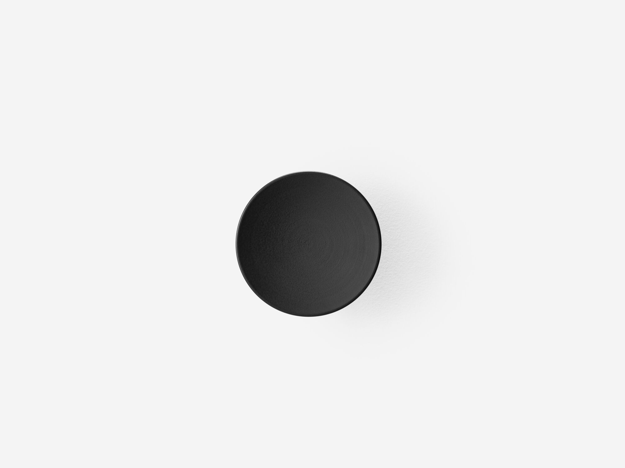 Front view of large black wall knob